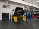 Bendpak 4 Post Lift 10000LB Disassembled, Used And Fully Functional. Fixed Price $2000.00.