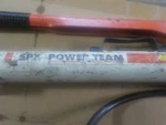 Spx Power Team Model 10,000 Psi Hydraulic Hand Pump W/ Hose Quick Connects. Fixed Price $200.00.